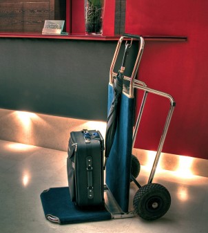 Folding hotel luggage cart lined with carpeting